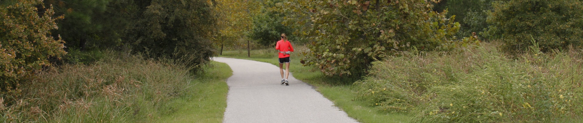 Runner on the Cypress Creek Greenway trail
